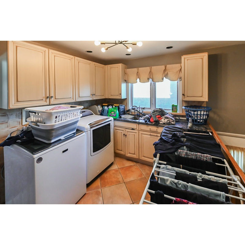 Millbrook Custom Traditional Cream Laundry Room with Washer & Dryer
